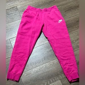 XL pink Nike sweatpants. Never worn. FITS LIKE SMALL. Reference I am 5’9 size 10